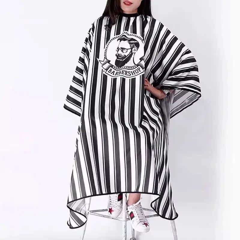Capa de peluquería de rayas negras y blancas para salón de peluquería y barbero