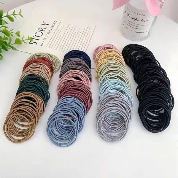 Lot de 100 élastiques pour cheveux tons pastels